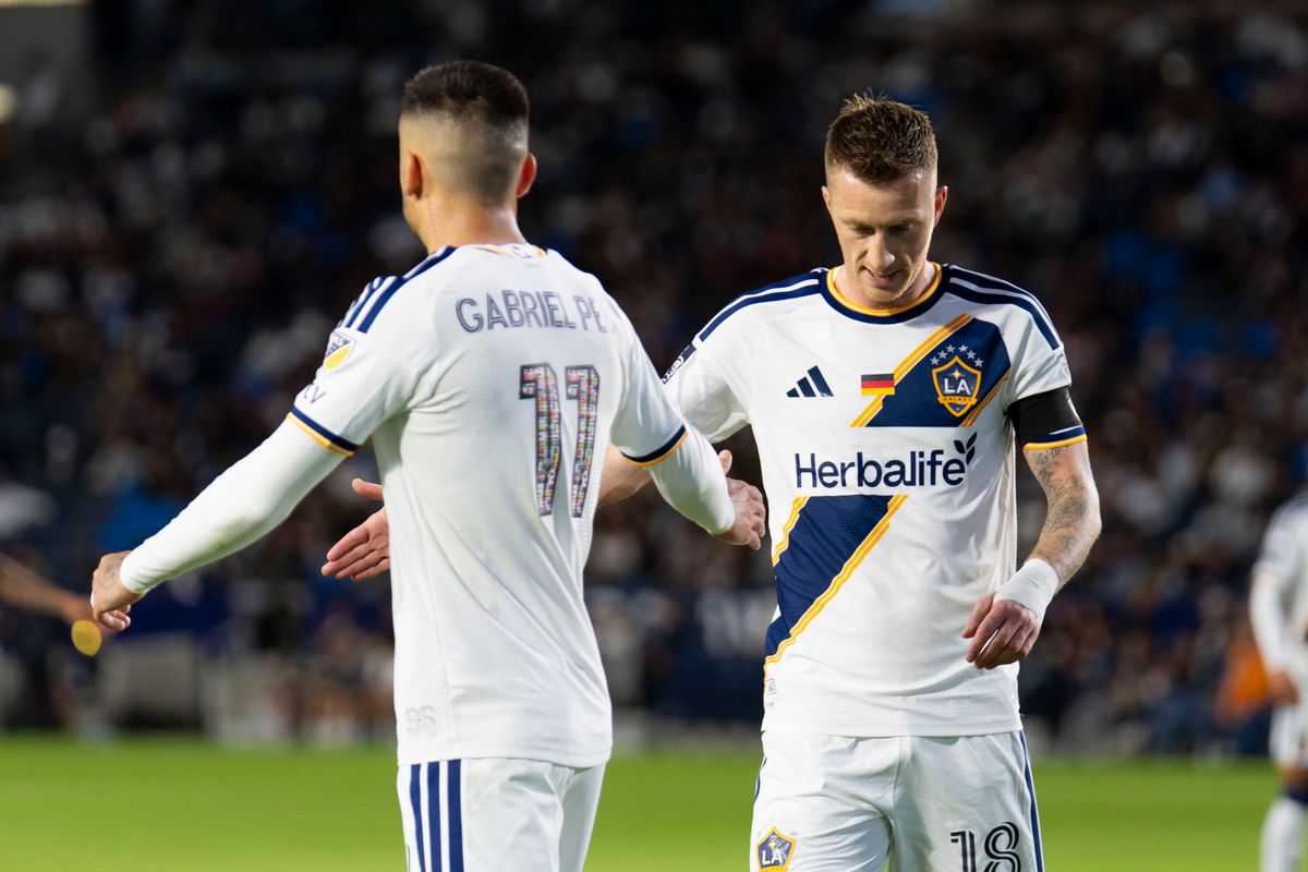 Los Angeles Galaxy midfielder Marco Reus (18) hi-fives forward Gabriel Pec (11) during an MLS soccer game against the Houston Dynamo FC, Saturday May 23rd, 2026 in Carson, California. Los Angeles Galaxy midfielder Marco Reus (18) hi-fives forward Gabriel Pec (11) during an MLS soccer game against the Houston Dynamo FC, Saturday May 23rd, 2026 in Carson, California.