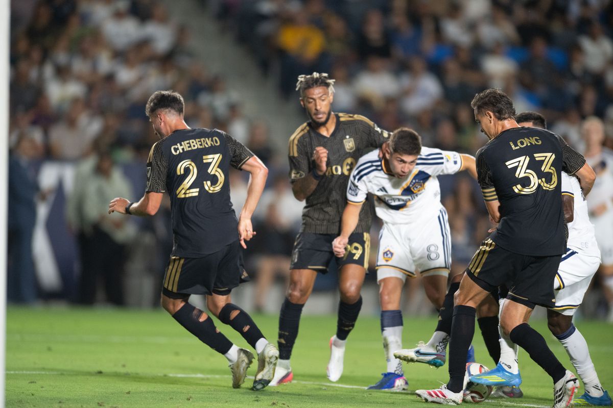 LA Galaxy midfielder Lucas Sanabria (8) gets tangled up between LAFC defenders during an MLS match between LAFC and LA Galaxy on Friday, July 17, 2026 at Dignity Health Sports Park in Carson, Calif LA Galaxy midfielder Lucas Sanabria (8) gets tangled up between LAFC defenders during an MLS match between LAFC and LA Galaxy on Friday, July 17, 2026 at Dignity Health Sports Park in Carson, Calif