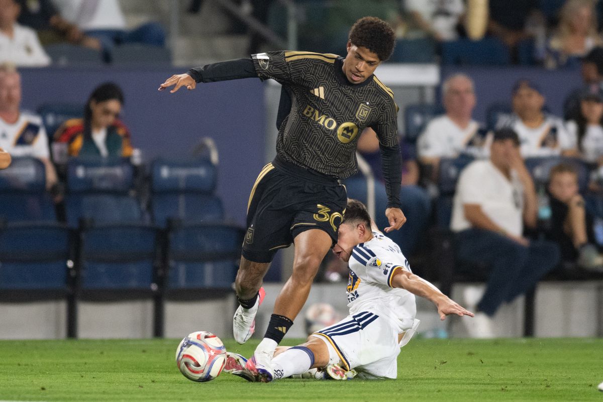 LA Galaxy midfielder Lucas Sanabria (8) tackles the ball away from LAFC forward David Martinez (30) during an MLS match between LAFC and LA Galaxy on Friday, July 17, 2026 at Dignity Health Sports Park in Carson, Calif LA Galaxy midfielder Lucas Sanabria (8) tackles the ball away from LAFC forward David Martinez (30) during an MLS match between LAFC and LA Galaxy on Friday, July 17, 2026 at Dignity Health Sports Park in Carson, Calif