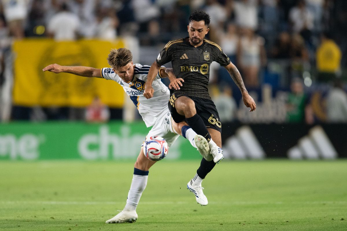 LA Galaxy defender John Nelson (14) battless for possession against LAFC midfielder Mathieu Choinière (66) during an MLS match between LAFC and LA Galaxy on Friday, July 17, 2026 at Dignity Health Sports Park in Carson, Calif LA Galaxy defender John Nelson (14) battless for possession against LAFC midfielder Mathieu Choinière (66) during an MLS match between LAFC and LA Galaxy on Friday, July 17, 2026 at Dignity Health Sports Park in Carson, Calif