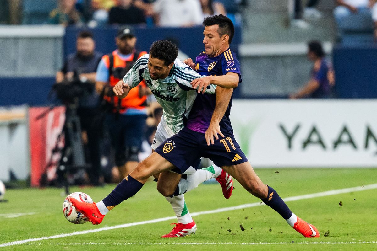 Los Angeles Galaxy forward Hirving Lozano (18) goes for the steal during an MLS game, against the New England Revolution on Saturday September 5th, 2026 in Carson, Calif
