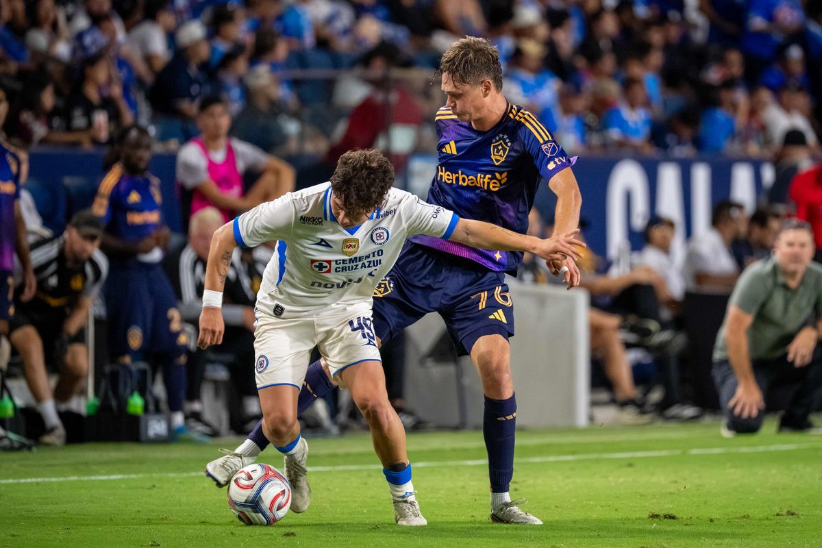 LA Galaxy midfielder Troy Elgersma fights for the ball against Cruz Azul defender Josué Díaz during a friendly soccer game, Sunday, October 4, 2026 in Carson, California.