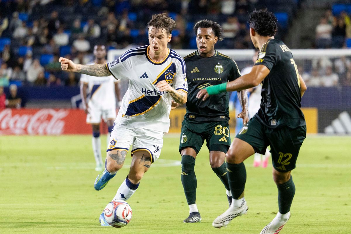 Los Angeles Galaxy forward Robert Taylor (21) run with the ball during a MLS soccer game against Portland Timbers, Wednesday October 14, 2026 in Carson, California. Los Angeles Galaxy forward Robert Taylor (21) run with the ball during a MLS soccer game against Portland Timbers, Wednesday October 14, 2026 in Carson, California.