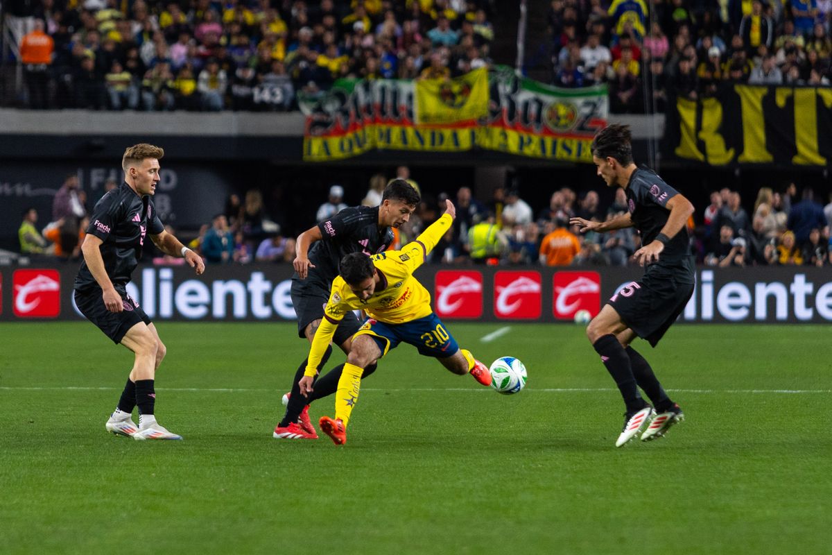 Club América midfielder Miguel Ramirez (210) tries to escape Inter Miami defenders during a soccer friendly match between Inter Miami and Club América, Saturday January 18, 2025 in Las Vegas, Nev.