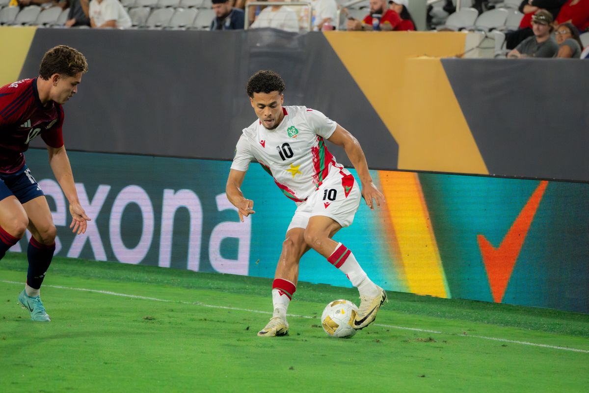 Suriname's Forward Denzel Jubitana #10 battling against Costa Rica's defenders during a Gold Cup Match on June 15, 2025 in San Diego, CA.