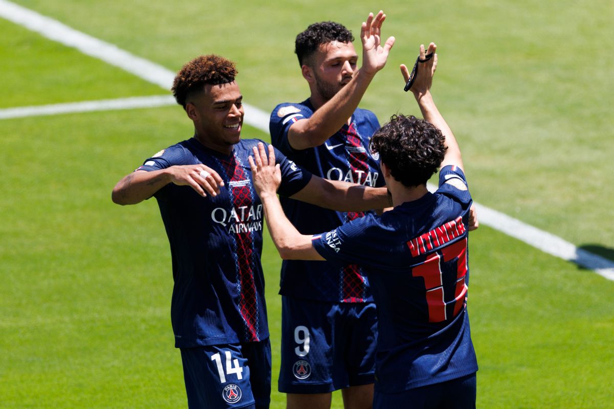 Vitinha #17 celebrates his goal with Désiré Doué #14 and Gonçalo Ramos #9 during the FIFA Club World Cup 2025 group B match between Paris Saint-Germain FC and Club Atletico de Madrid at Rose Bowl Stadium on June 15, 2025 in Pasadena, California.