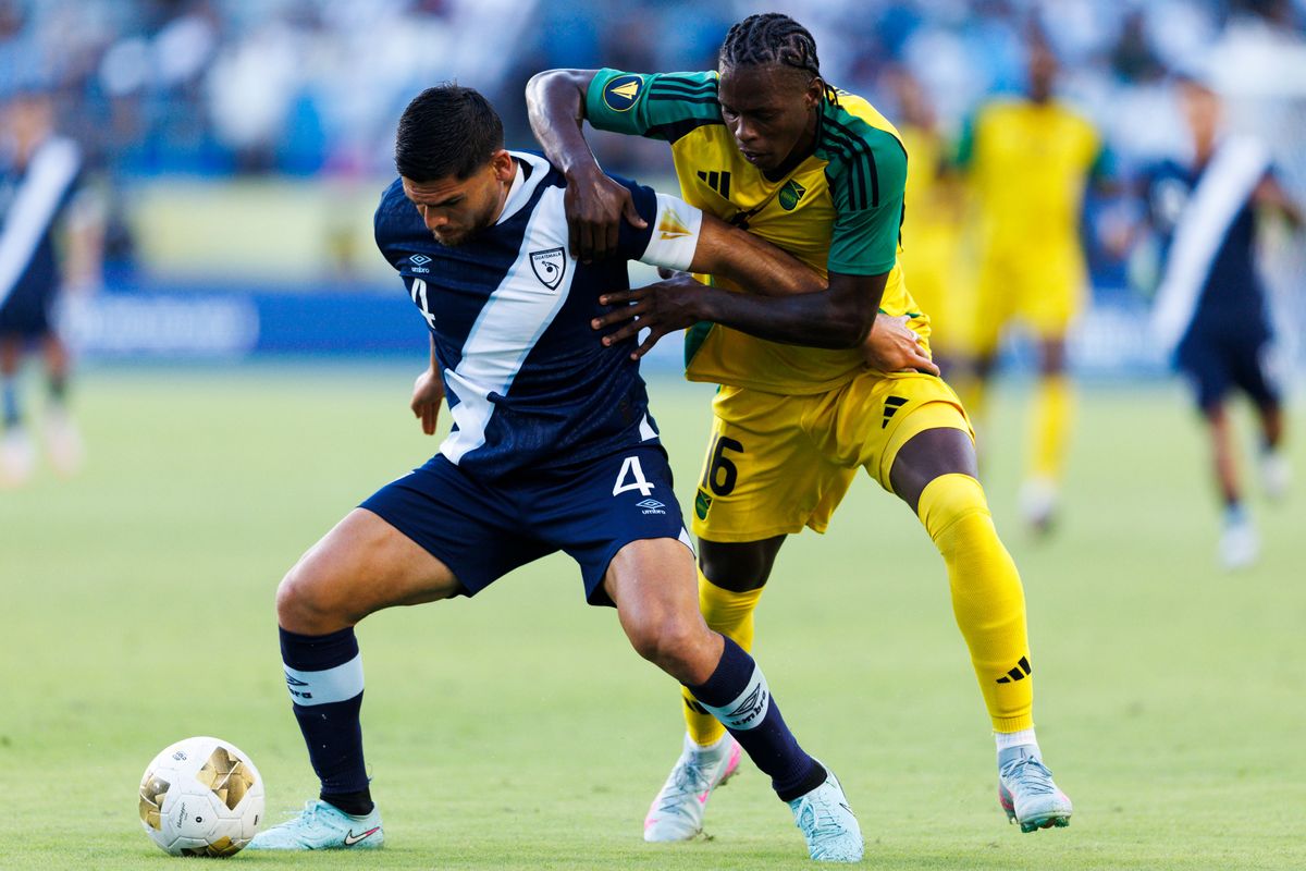 Jose Pinto #4 of Guatemala and W. Brown #16 of Jamaica battle for the ball during the Group Stage - Group C match as part of the 2025 CONCACAF Gold Cup at Dignity Health Sports Park on June 16, 2025 in Carson, California.