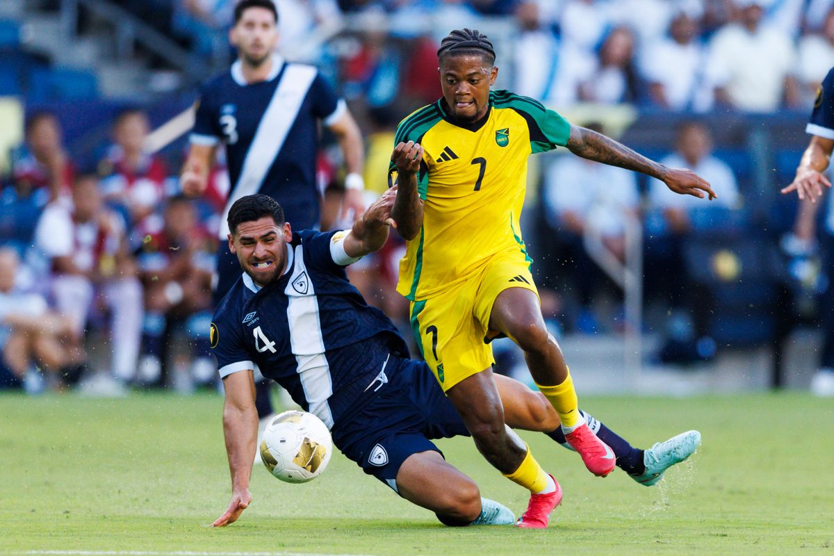 Jose Pinto #4 of Guatemala and L. Bailey #7 of Jamaica battle for the ball during the Group Stage - Group C match as part of the 2025 CONCACAF Gold Cup at Dignity Health Sports Park on June 16, 2025 in Carson, California. 