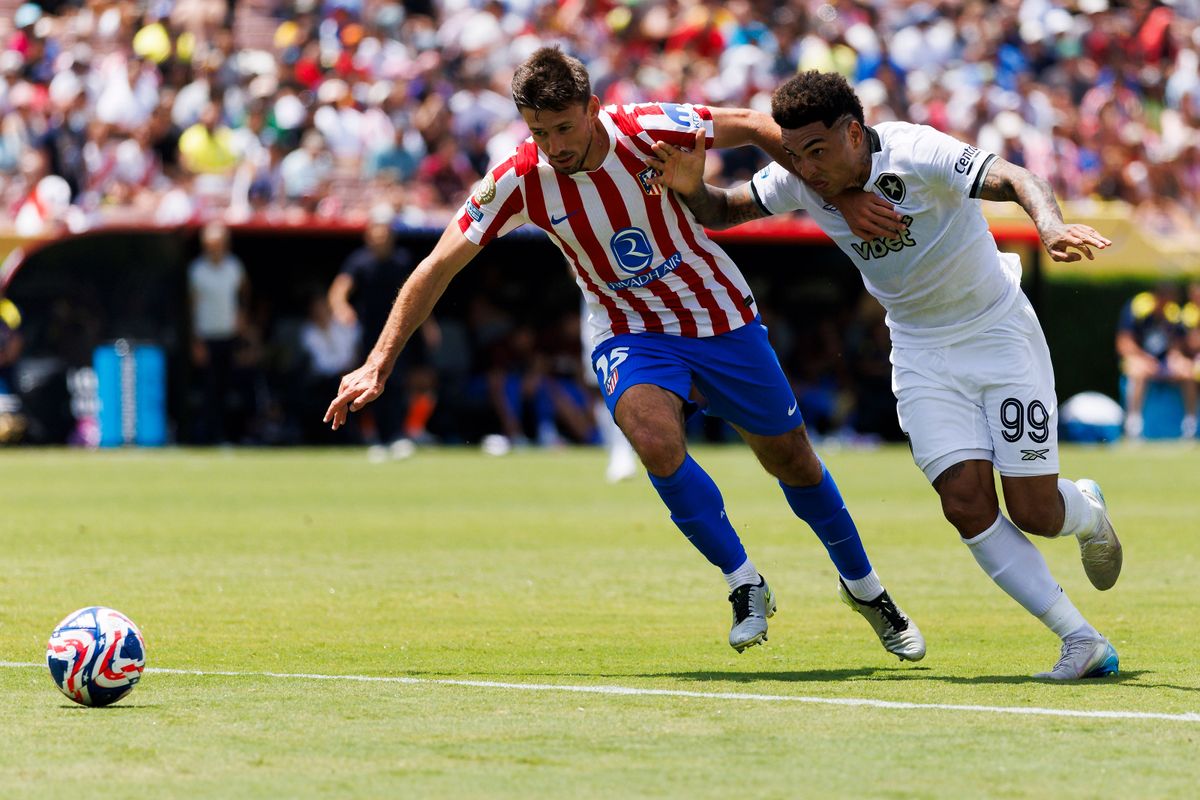 Clément Lenglet #15 of Atlético Madrid and Igor Jesus #99 of Botafogo chase after a loose ball during the FIFA Club World Cup 2025 group B match at Rose Bowl Stadium on June 23, 2025 in Pasadena, California.