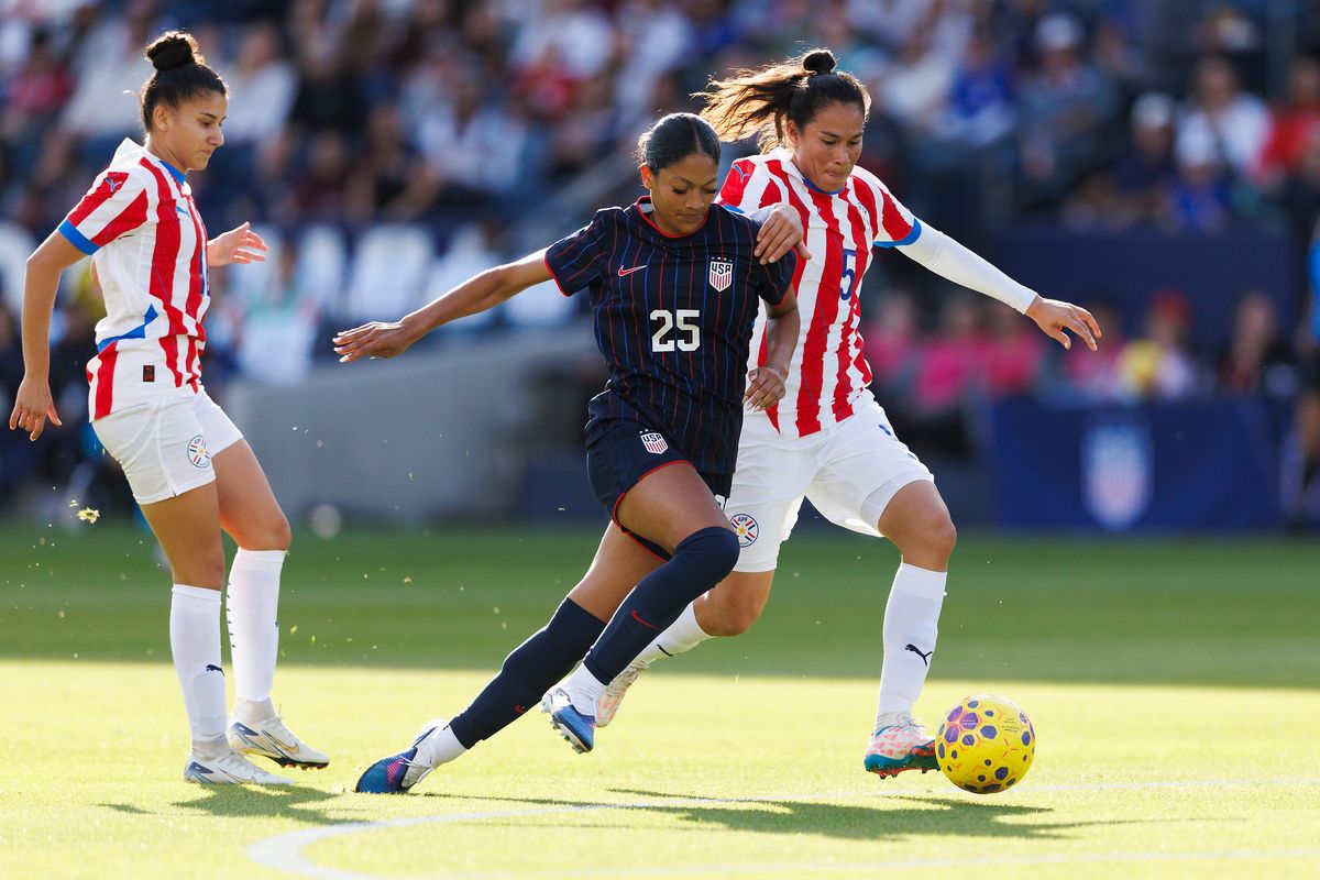 Reilyn Turner #25 of USWNT battles for control during the game against Paraguay at Dignity Health Sports Park on January 24, 2026 in Carson, California.
