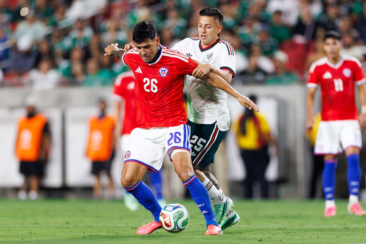 Diego Ulloa #26 of Chile battles for position during the match against Mexico at Los Angeles Memorial Coliseum on October 6, 2026 in Los Angeles, California. 