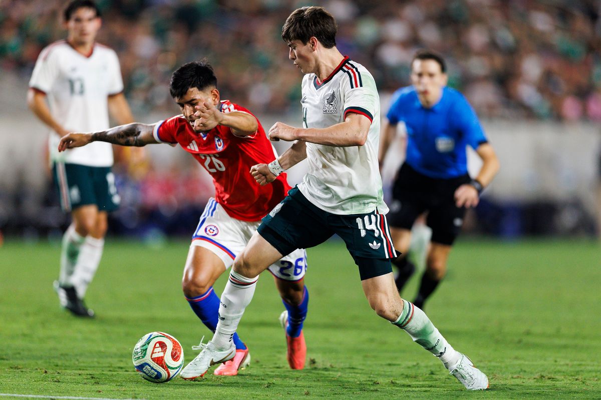 Armando Gonzalez #14 of Mexico kicks the ball during the match against Chile at Los Angeles Memorial Coliseum on October 6, 2026 in Los Angeles, California.