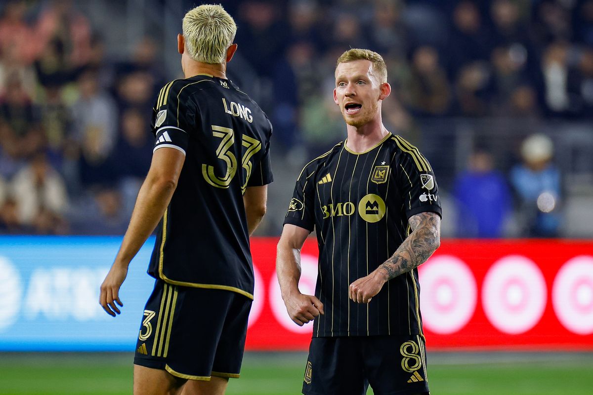 LAFC Midfielder Lewis O’Brien (8) provides defensive tips to teammate Aaron Long (33) during match against the Vancouver Whitecaps FC on Friday, November 8, 2024 in Los Angeles, CA. 