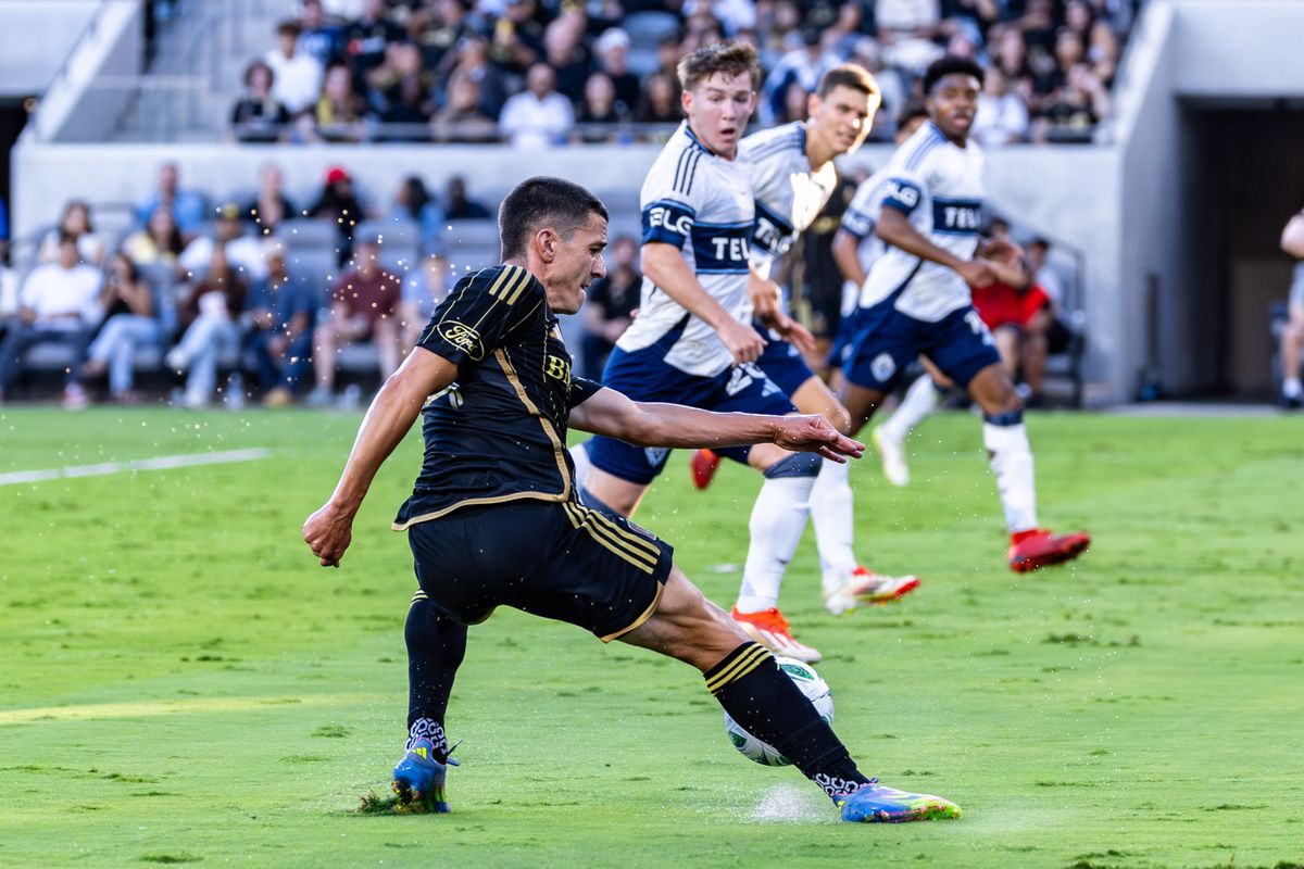LAFC defender Sergi Palencia (14) makes a stop during an MLS match against the Vancouver Whitecaps, Sunday June 29, 2025 in Los Angeles, Calif. LAFC defender Sergi Palencia (14) makes a stop during an MLS match against the Vancouver Whitecaps, Sunday June 29, 2025 in Los Angeles, Calif.