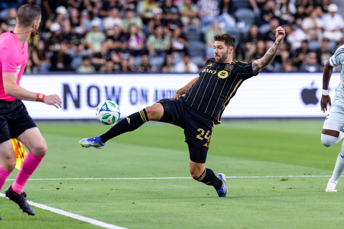 LAFC midfielder Ryan Hollingshead (24) goes for a ball during an MLS match against the Colorado Rapids, Wednesday July 9, 2025 in Los Angeles, Calif.