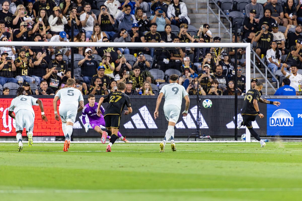 LAFC forward Denis Bouanga (99) scores on a penalty kick to give his team the early 1-0 lead during an MLS match against the Colorado Rapids, Wednesday July 9, 2025 in Los Angeles, Calif.