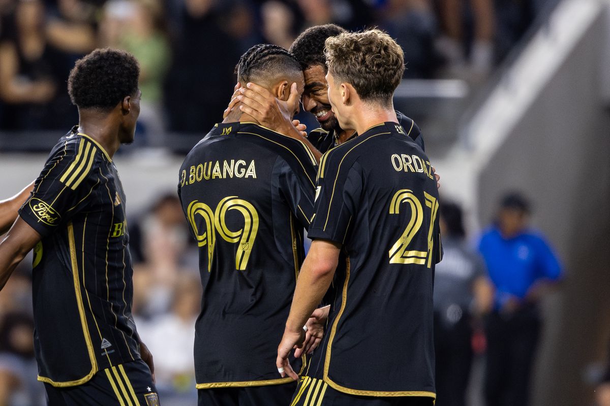 LAFC forward Denis Bouanga (99) and midfielder Timothy Tillman (11) celebrate the goal putting their team up 3-0 during an MLS match against the Colorado Rapids, Wednesday July 9, 2025 in Los Angeles, Calif.