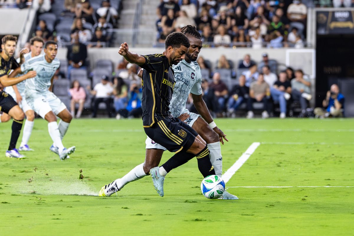 LAFC midfielder Timothy Tillman (11) tries to get past Colorado Rapids defender Chidozie Awaziem (6) during an MLS match, Wednesday July 9, 2025 in Los Angeles, Calif.