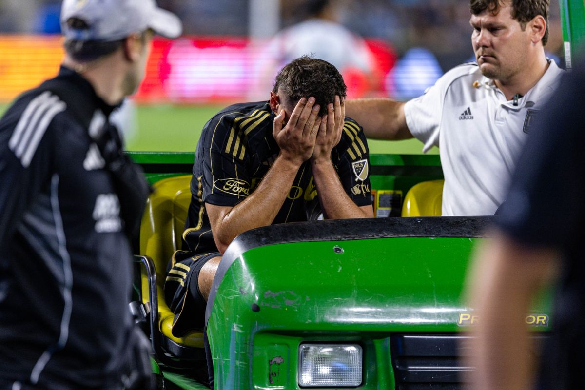 LAFC defender and captain Aaron Long (33) is carted off the field with an injury during an MLS match against FC Dallas, Saturday July 12, 2025 in Los Angeles, Calif.