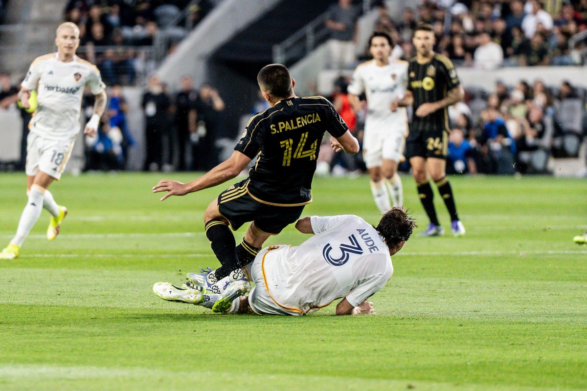 LAFC Sergi Palencia (14) gets his legs taken out in a game against the LA Galaxy, Saturday July 19, 2025 in Los Angeles, Calif.