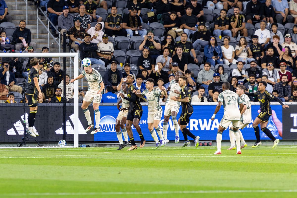 Portland Timbers defender Finn Surman (20) heads a ball away from the goal during an MLS match against LAFC, Friday July 25, 2025 in Los Angeles, Calif.
