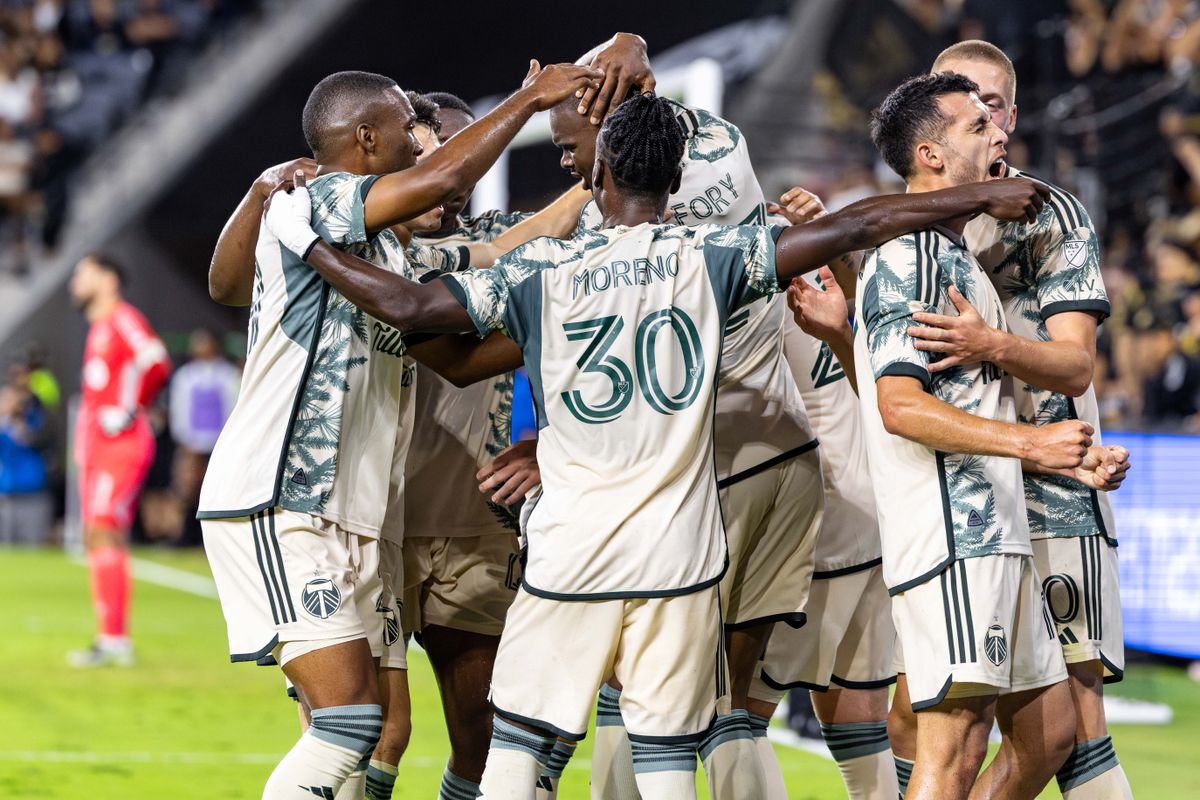 The Portland Timbers celebrate the lone goal of the match by midfielder Cristhian Paredes (17) during an MLS match against LAFC, Friday July 25, 2025 in Los Angeles, Calif.