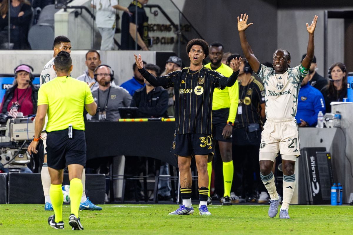 LAFC forward David Martínez (30) and Portland Timbers midfielder Diego Chará (21) both question a call during an MLS match, Friday July 25, 2025 in Los Angeles, Calif.
