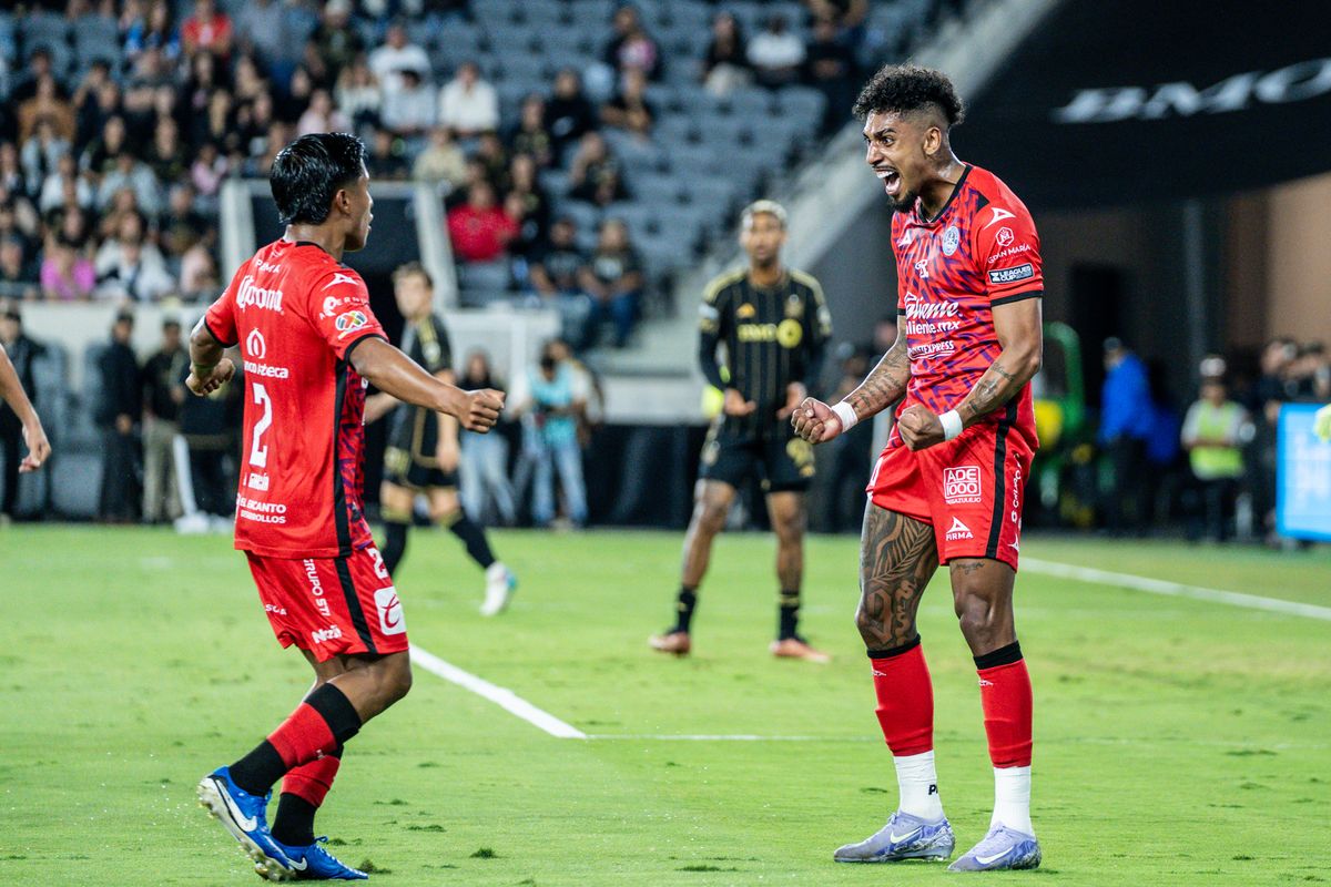 Two teammates from Maztlan FC celebrate a first half goal in a game against LAFC, Tuesday July 29, 2025 in Los Angeles, Calif.