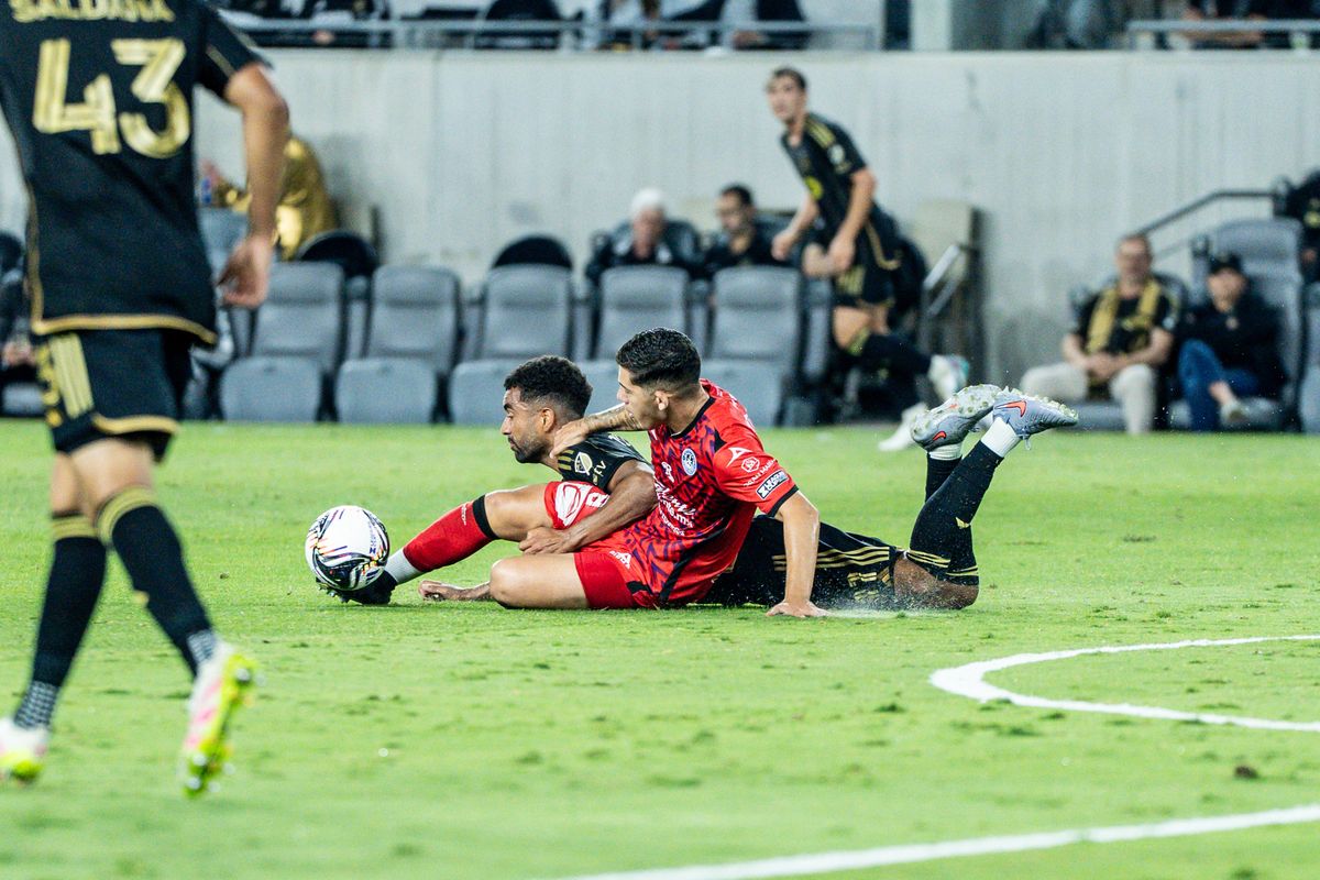 LAFC player gets taken out by the defender in a game against Maztlan FC, Tuesday July 29, 2025 in Los Angeles, Calif.