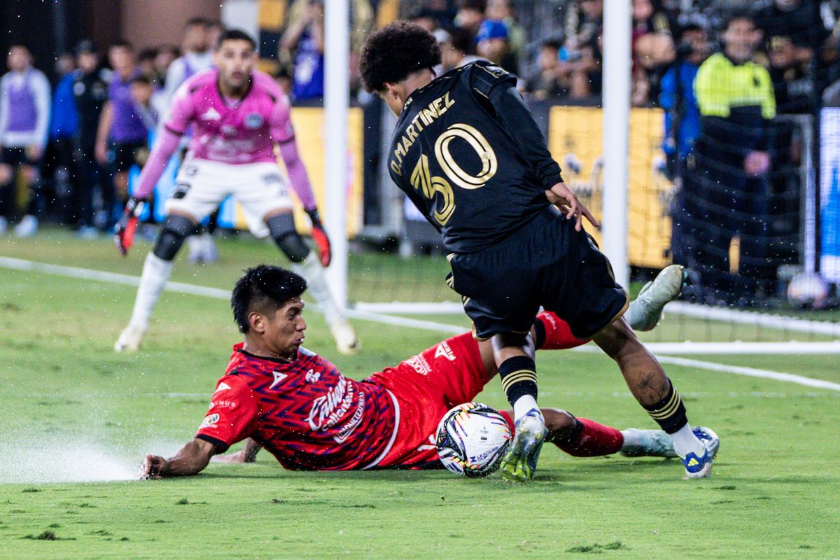 LAFC Midfielder David Martinez (30) makes the defender fall after great footwork with the ball in a game against Maztlan FC, Tuesday July 29, 2025 in Los Angeles, Calif.