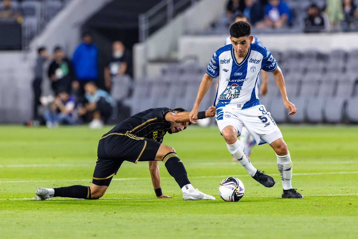 LAFC midfielder Marco Delgado (8) tries to stop Pachuca midfielder Pedro Pedraza (5) from pushing the ball upfield during a Leagues Cup match, Friday August 1, 2025 in Los Angeles, Calif.