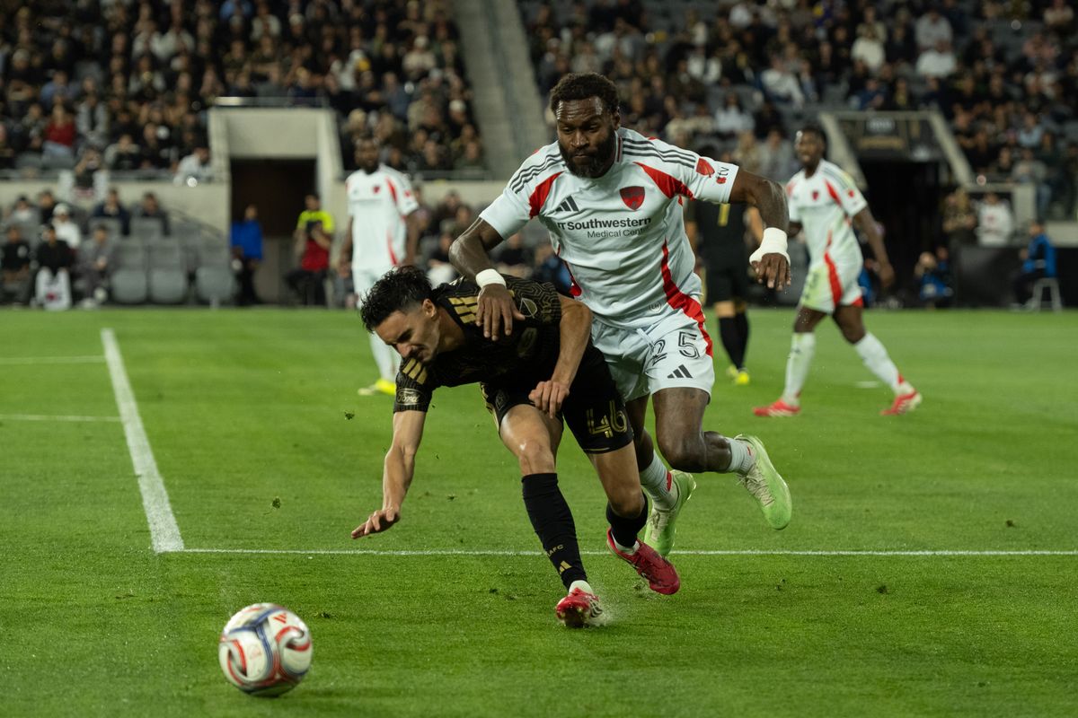 FC Dallas defender Sebastien Ibeagha (25) tackles LAFC midfielder Stephen Eustáquio (46) during an MLS game between LAFC and FC Dallas on Saturday, March 7, 2026 at BMO Stadium in Los Angeles Calif