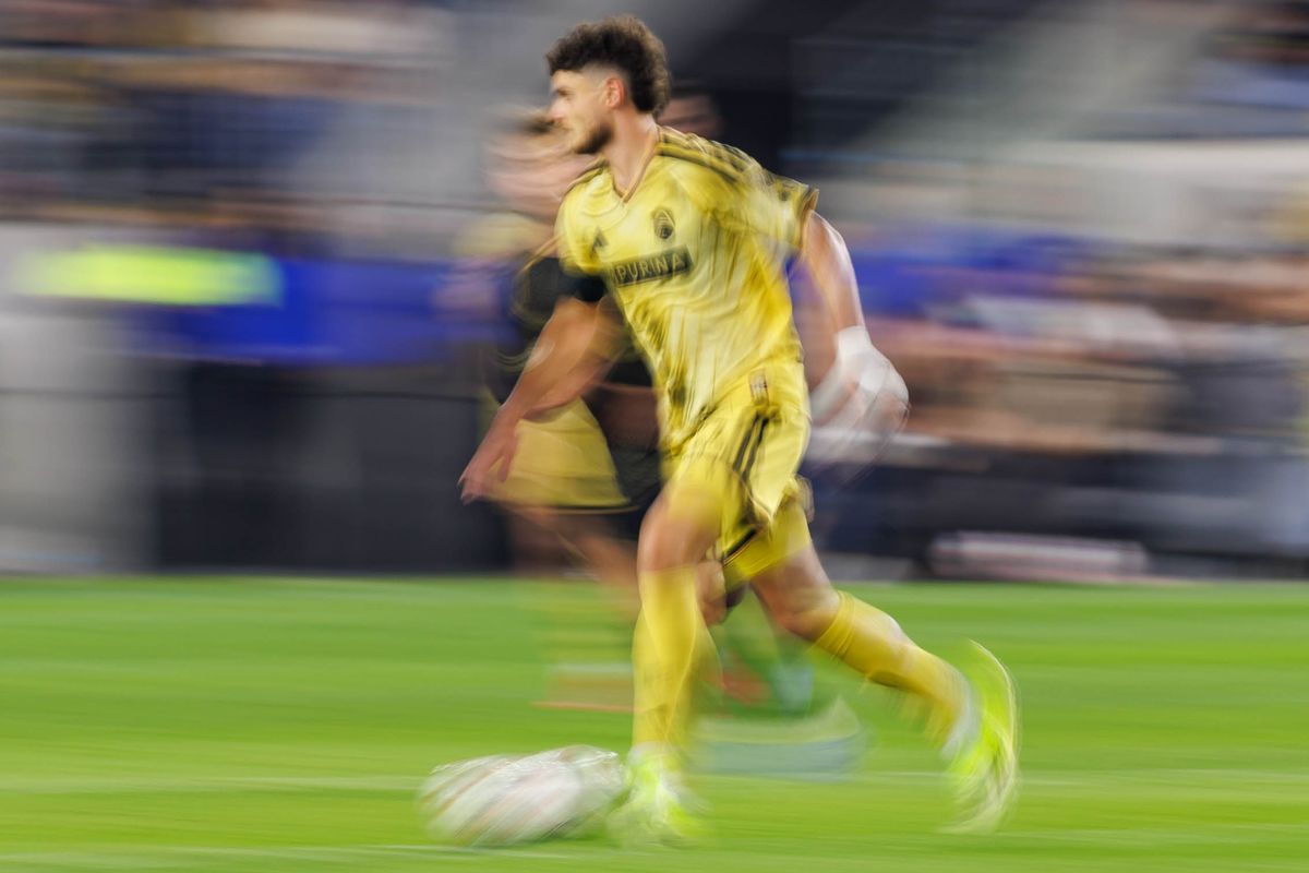 St. Louis FC midfielder Dante Polvara (#17) dribbles the ball during an MLS match against LAFC on March 14, 2026 in Los Angeles, California.
