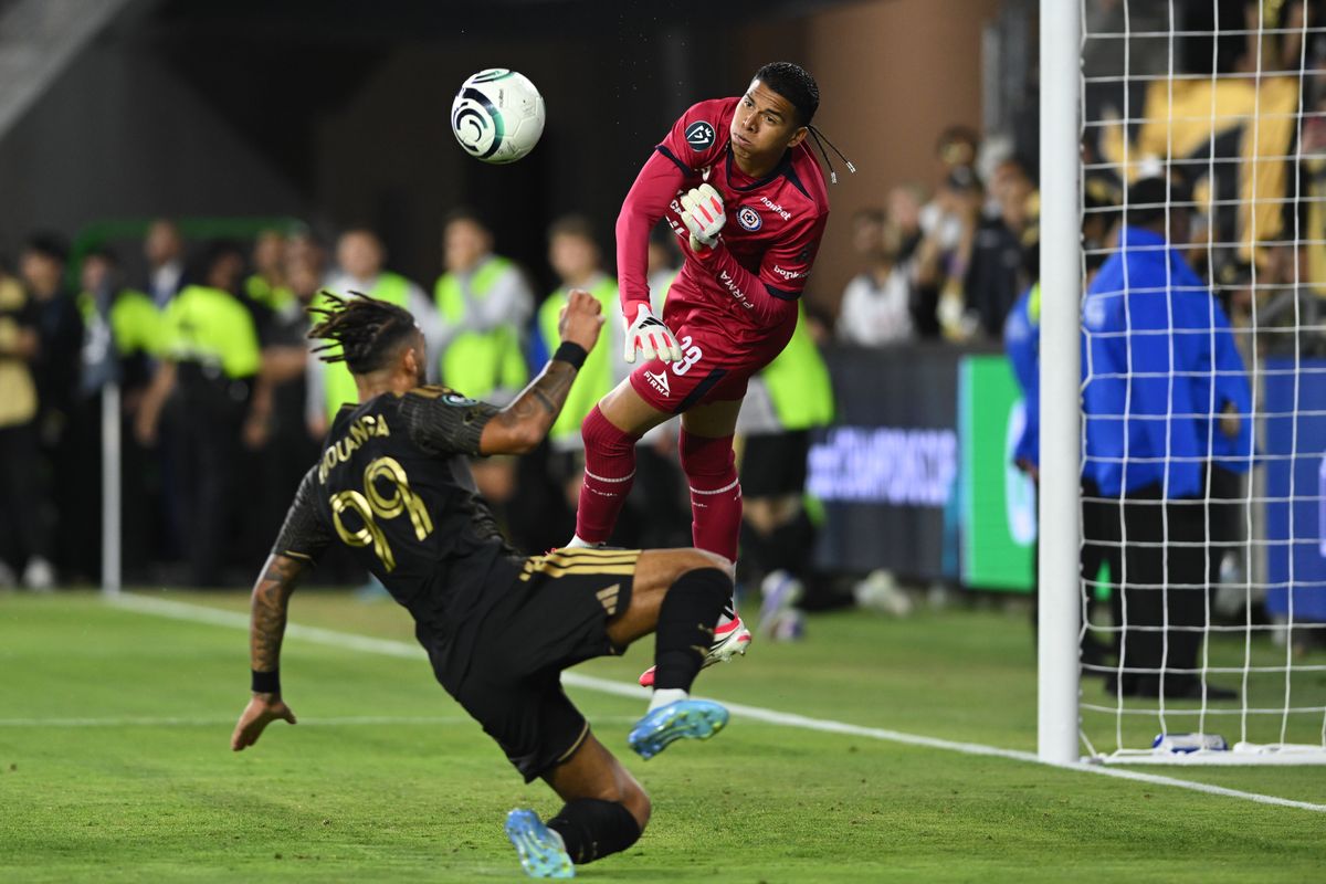 Cruz Azul goalkeeper Kevin Mier (23) punches the ball away from LAFC forward Denis Bouanga (99) during a CONCACAF Champions match between LAFC and Cruz Azul on Tuesday, April 7, 2026 at BMO Stadium in Los Angeles Calif Cruz Azul goalkeeper Kevin Mier (23) punches the ball away from LAFC forward Denis Bouanga (99) during a CONCACAF Champions match between LAFC and Cruz Azul on Tuesday, April 7, 2026 at BMO Stadium in Los Angeles Calif
