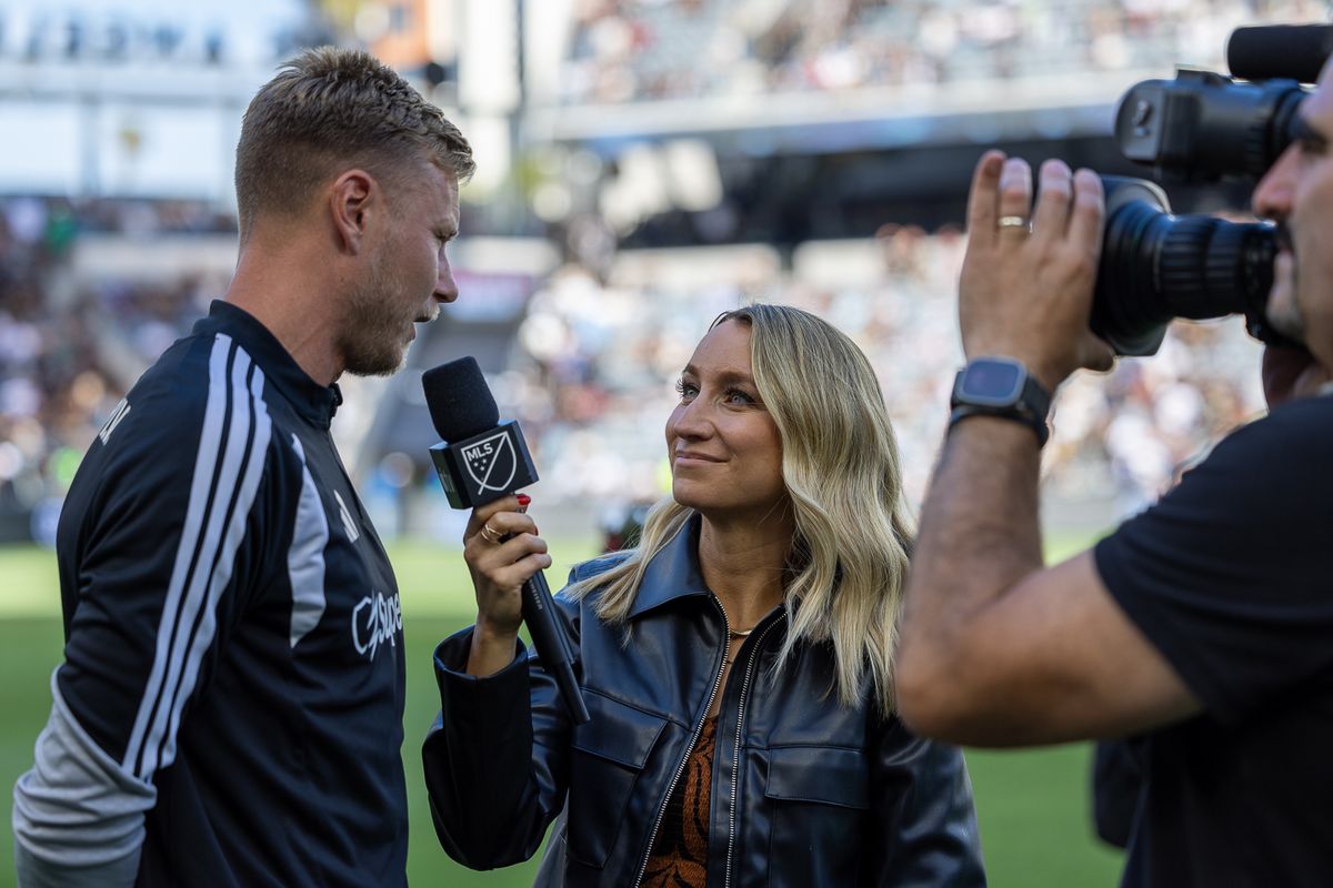 Jillian Sakovits (host and sideline reporter) interviews Andy Rose during halftime of an MLS soccer match between LAFC and the San Jose Earthquakes, Sunday, April 19, 2026, in Los Angeles, Calif.