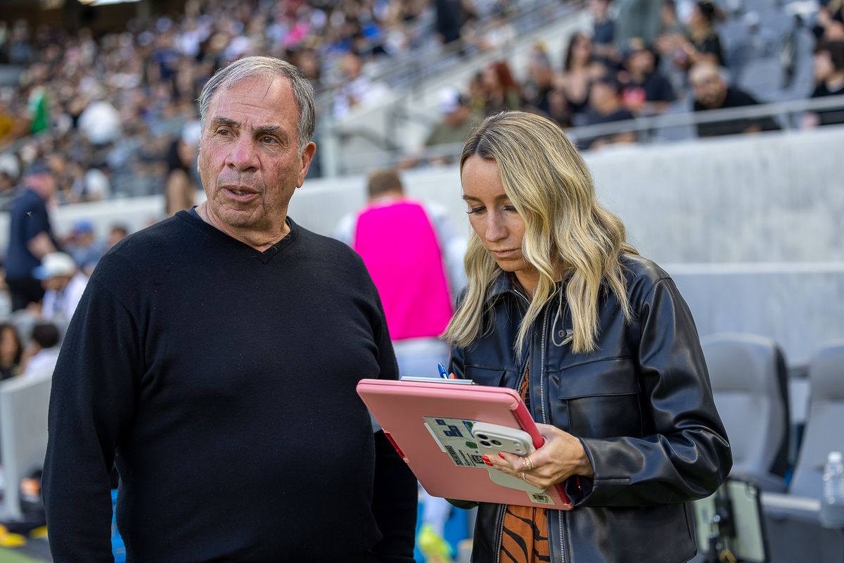 Jillian Sakovits (host and sideline reporter) speaks with San Jose Earthquakes head coach Bruce Arena during halftime of an MLS soccer match between LAFC and the San Jose Earthquakes, Sunday, April 19, 2026, in Los Angeles, Calif.