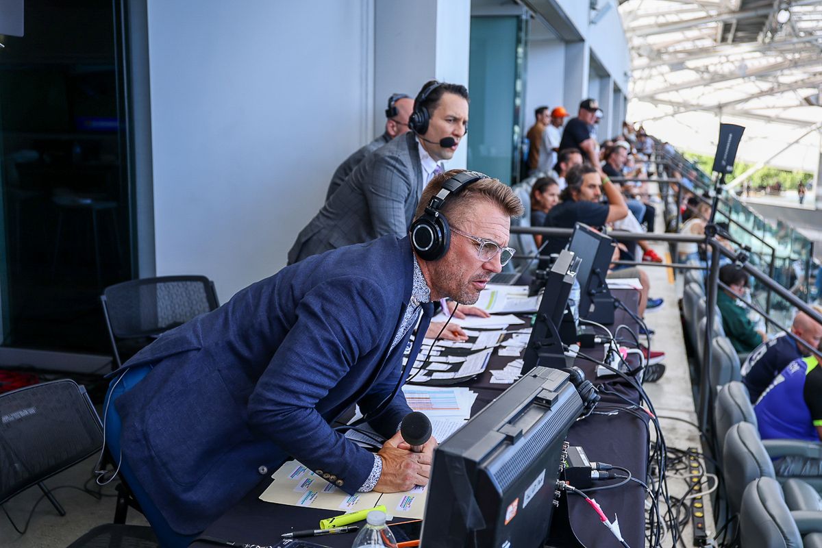 Jake Zivin (play-by-play announcer) and Taylor Twellman (match analyst) call an MLS match on Apple TV.