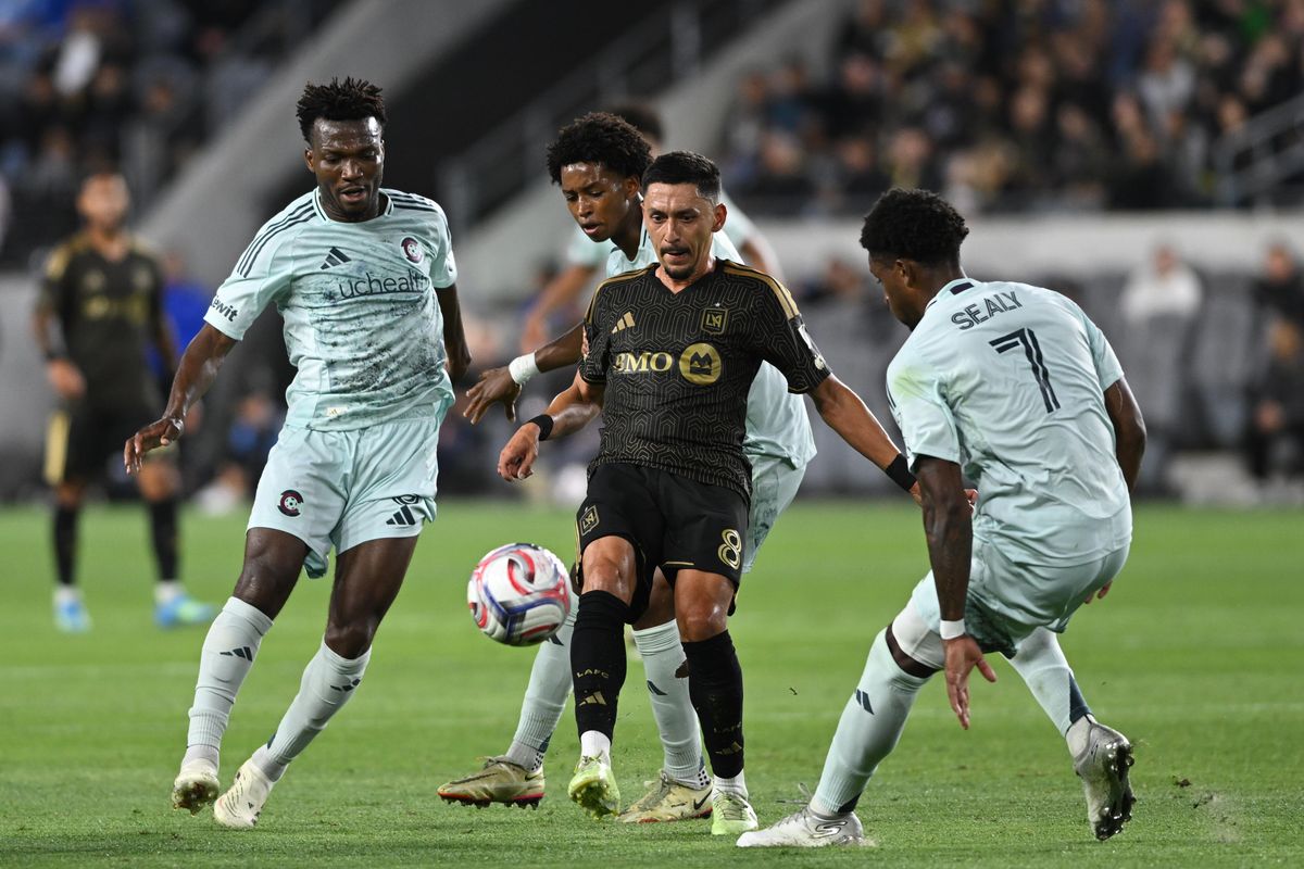 LAFC midfielder Mark Delgado (8) chips the ball away to safety during an MLS game between LAFC and Colorado Rapids on Wednesday, April 22, 2026 at BMO Stadium In Los Angeles Calif at BMO Stadium in Los Angeles Calif