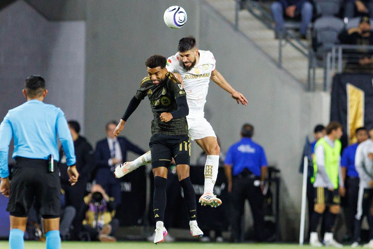 Timothy Tillman #11 of LAFC battles for a heading during a CONCACAF Champions Cup Semifinal match against Toluca on April 29, 2026 at BMO Stadium in Los Angeles, California.