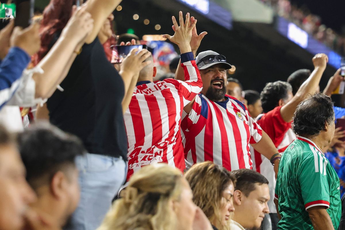 Chivas de Guadalajara fans high five in the stands after a goal during a Leagues Cup match between LAFC and Chivas de Guadalajara, Wednesday August 5, 2026 in Los Angeles, Calif. Chivas de Guadalajara fans high five in the stands after a goal during a Leagues Cup match between LAFC and Chivas de Guadalajara, Wednesday August 5, 2026 in Los Angeles, Calif.