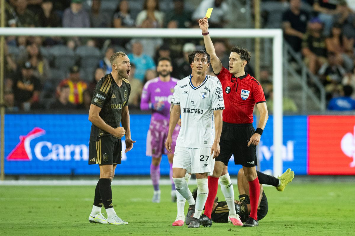 Referee issues a yellow card to Queretaro defender Daniel Parra (27) during a Leagues Cup match between Queretaro and Los Angeles FC on Wednesday, August 12, 2026 at BMO Stadium in Los Angeles Calif.