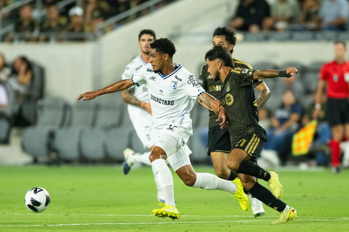 Queretaro defender Paulo Victor (12) protects the ball from LAFC defenders during a Leagues Cup match between Queretaro and Los Angeles FC on Wednesday, August 12, 2026 at BMO Stadium in Los Angeles Calif.