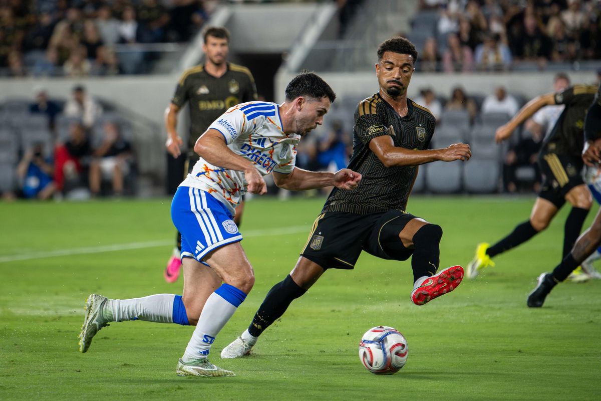 Los Angeles FC midfielder Timothy Tillman (11) blocks a cross by San Diego FC midfielder Gabriel Pirani (12) during an MLS soccer game, Saturday, August 15, 2026 in Los Angeles, California.