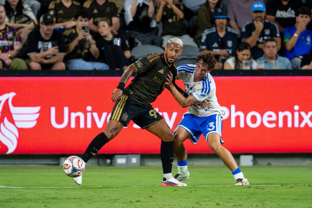 Los Angeles FC forward Denis Bouanga (99) shields the ball from San Diego FC defender Oscar Verhoeven (33) during an MLS soccer game, Saturday, August 15, 2026 in Los Angeles, California.