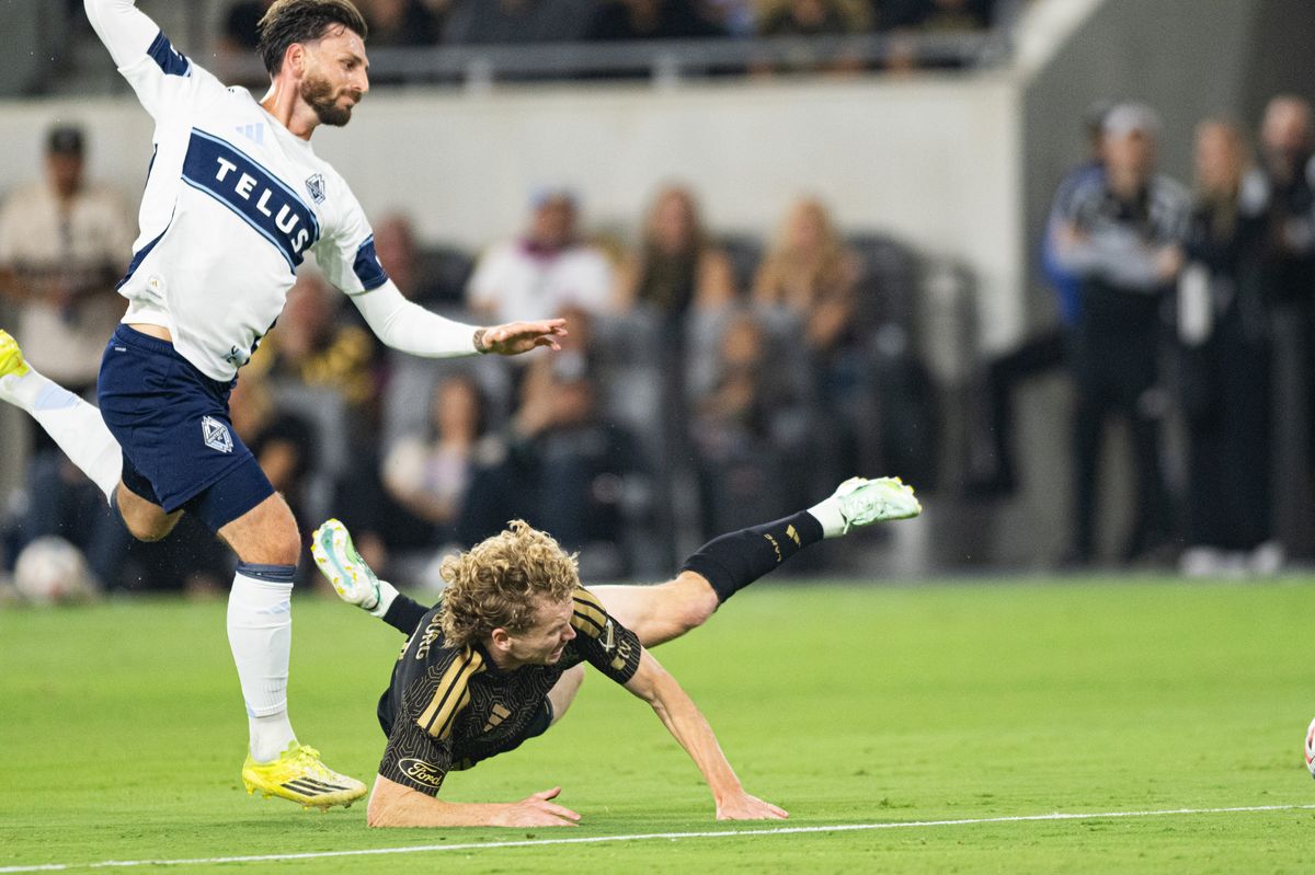 LAFC forward Jacob Shaffelburg (18) gets tackled during an MLS soccer game against the Vancouver Whitecaps, Saturday, October 10, 2026 in Los Angeles. LAFC forward Jacob Shaffelburg (18) gets tackled during an MLS soccer game against the Vancouver Whitecaps, Saturday, October 10, 2026 in Los Angeles.