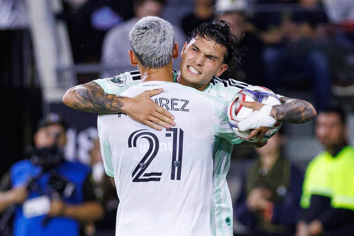 Brandon Vasquez #9 of Austin FC celebrates with Christian Ramirez #21 of Austin FC after scoring a goal during an MLS regular season match against LAFC on October 14, 2026 at BMO Stadium in Los Angeles, California.
