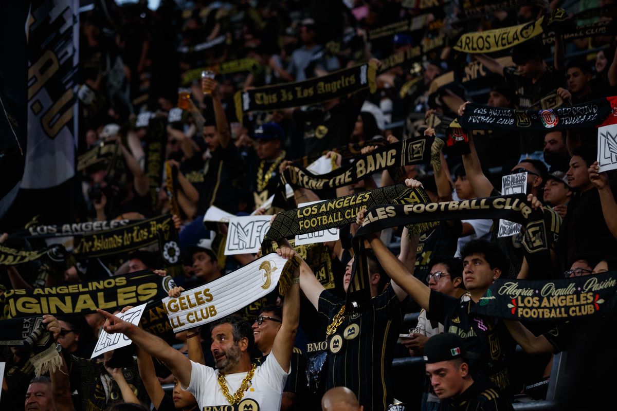 LAFC fans lift up their scarves before an MLS regular season match against LA Galaxy on October 25, 2026 at BMO Stadium in Los Angeles, California. LAFC fans lift up their scarves before an MLS regular season match against LA Galaxy on October 25, 2026 at BMO Stadium in Los Angeles, California.