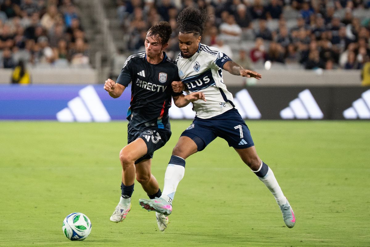 San Diego FC Right Back Oscar Verhoeven (33) battles for the ball during an MLS match against Vancouver Whitecaps FC on July 19, 2025 at Snapdragon Stadium in San Diego, CA.