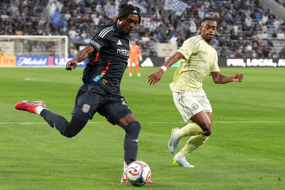 San Diego FC midfielder Manu Duah (26) crosses the ball during an MLS soccer game against the Portland Timbers, Saturday April 25, 2026 in San Diego, California.