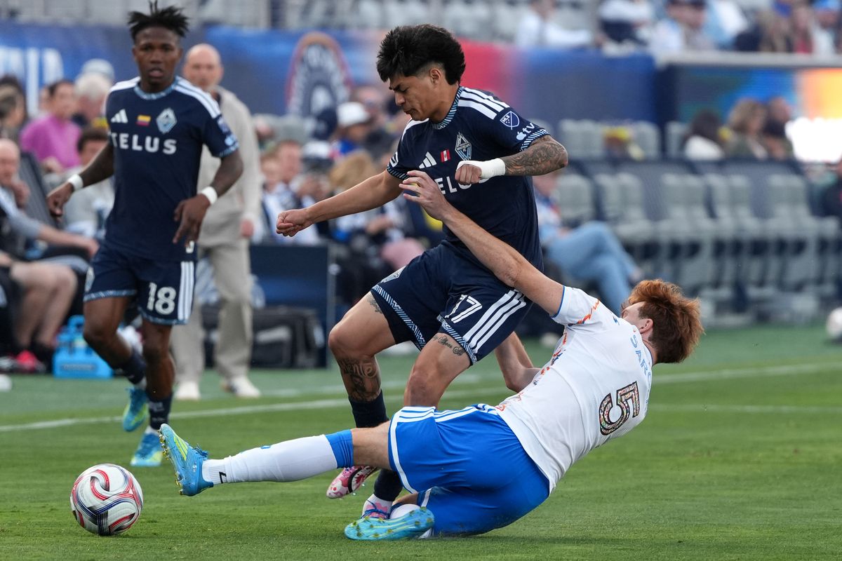 San Diego FC defender Kieran Sargeant (5) slides for the ball during an MLS soccer game against the Vancouver Whitecaps, Saturday May 23, 2026 in San Diego, California.